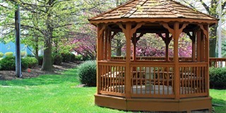 wood gazebo pavilion with a ramp and tower roof design