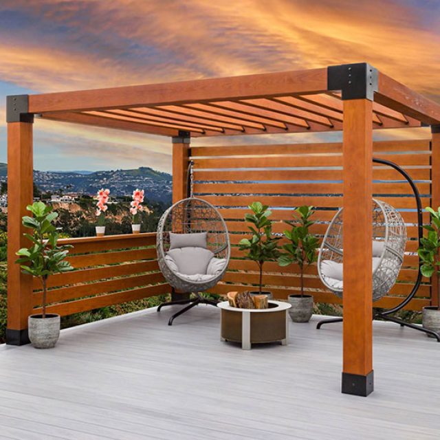 open wood pavilion with slatted roof, privacy screens, potted plants, and hanging egg chairs